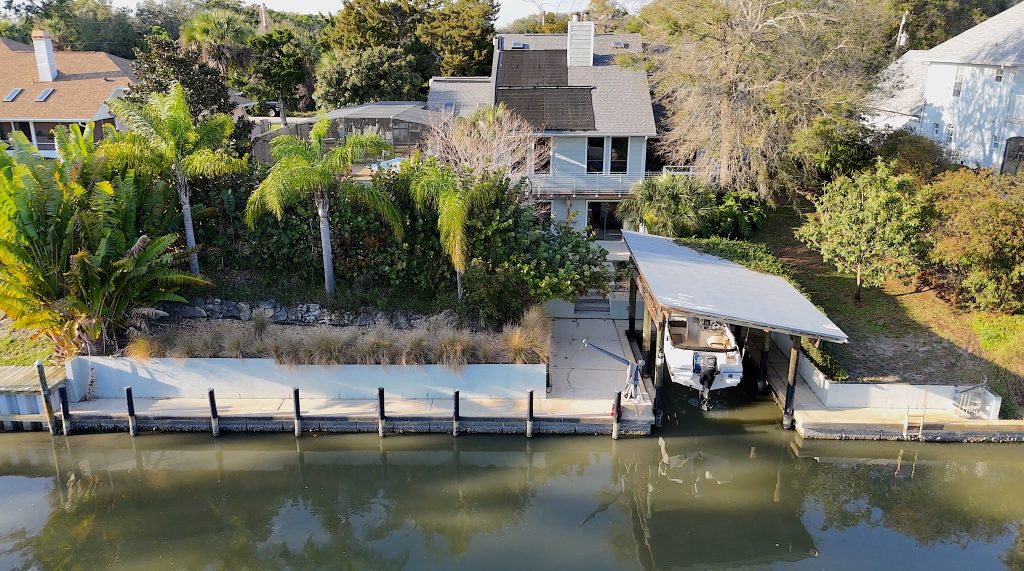 Aerial view of waterfront property at 124 Godfrey Road, Edgewater, FL